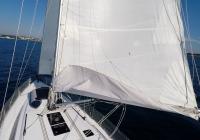 sailing yacht  mast sails mainsail dinghy on deck